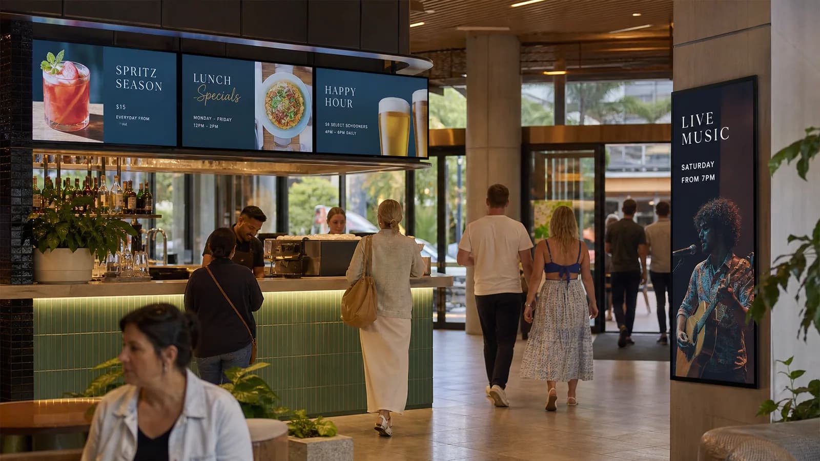 Hospitality venue with horizontal menu LED signage and vertical event display