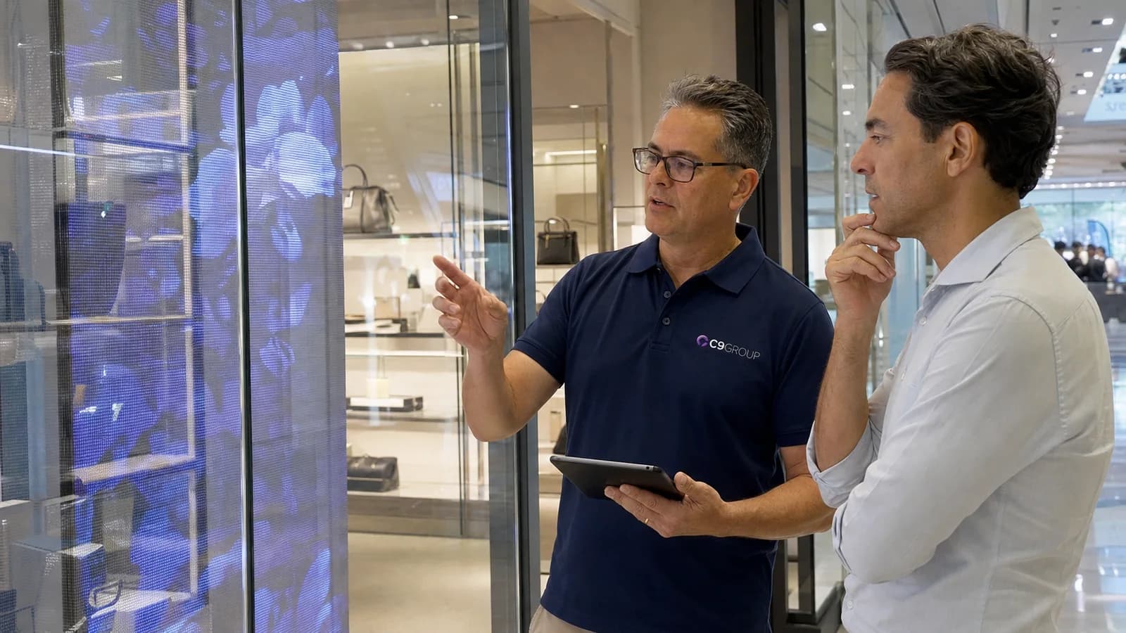 Transparent OLED display being reviewed in a real demonstration environment